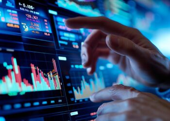 In a futuristic setup, a finance expert is carefully examining a vibrant display of fluctuating stock market charts. On a sophisticated digital interface, their fingers hover and point at critical data points, indicating a deep analysis of market trends and investment opportunities. The scene is a snapshot of the fast-paced world of finance where technology and human expertise blend to make strategic decisions.